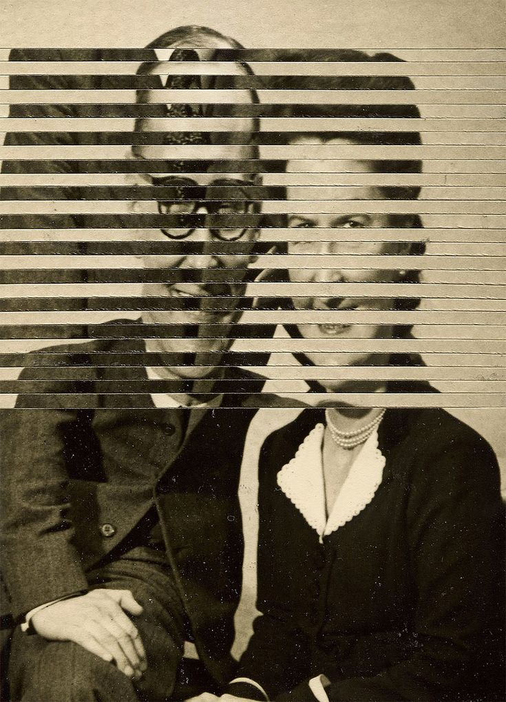 a man and woman sitting next to each other in front of a wall with horizontal lines