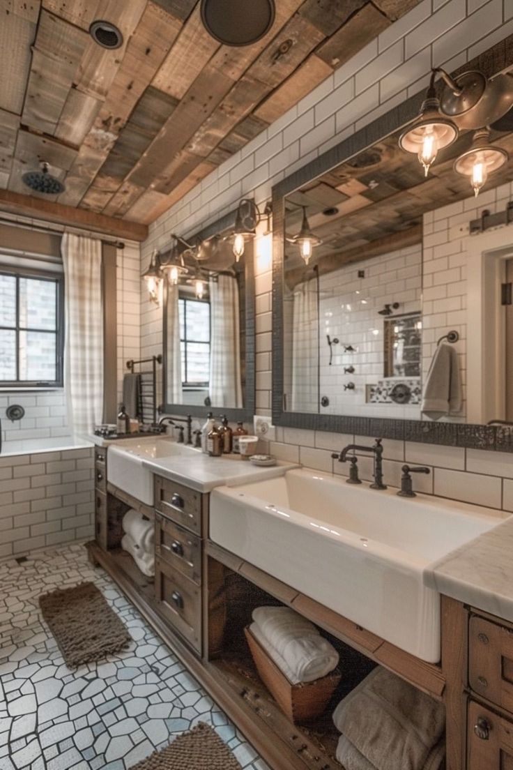 a bathroom with two sinks, mirrors and lights on the ceiling is shown in this image