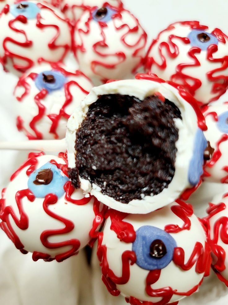 red, white and blue cake pops with chocolate in the middle