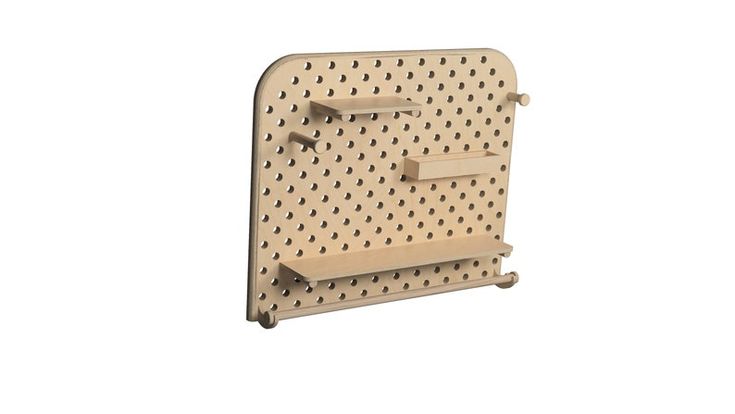 a wooden peg board with holes on the front and back sides, attached to a wall