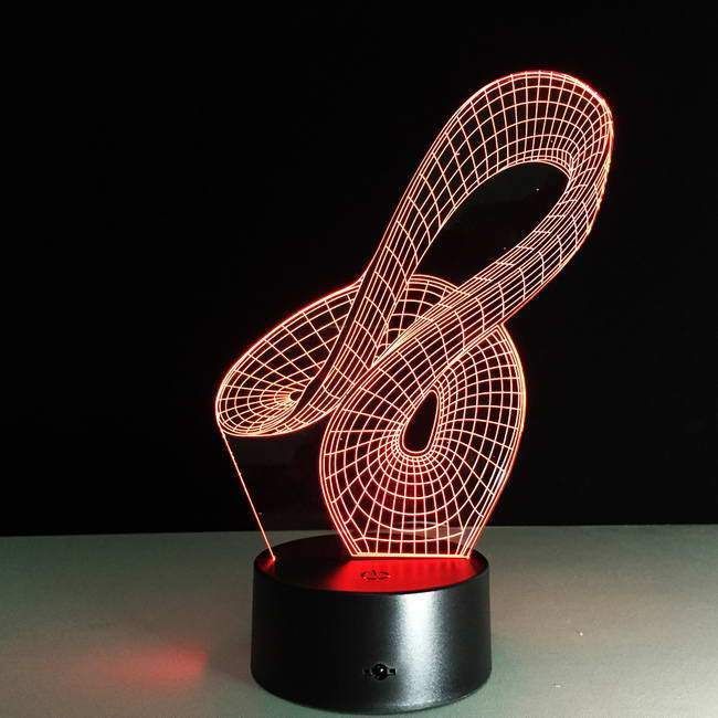 an illuminated music note sitting on top of a table