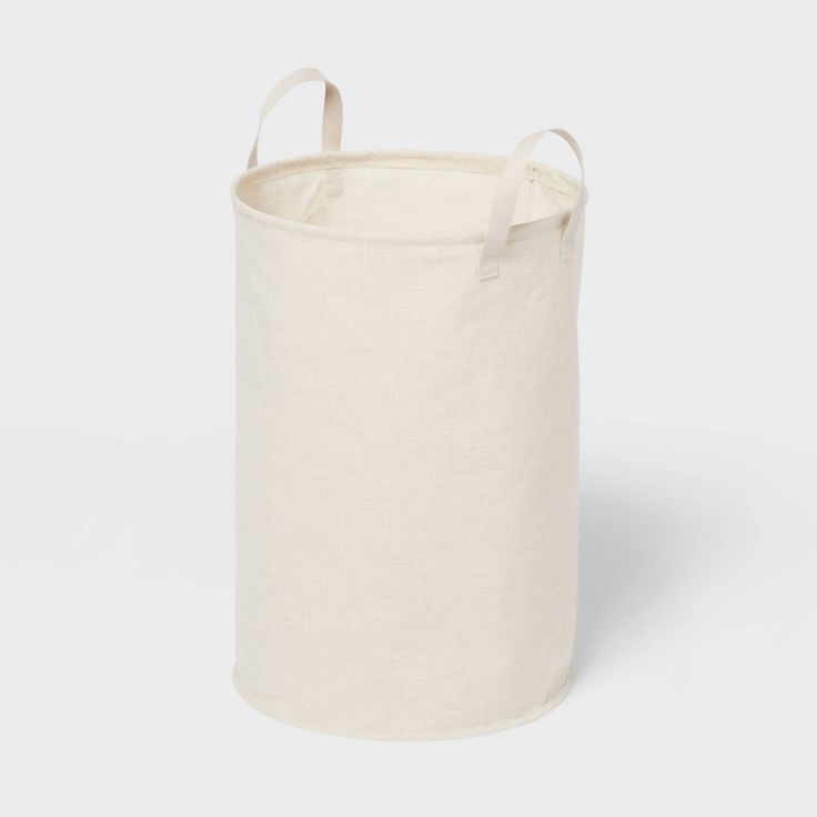 a white canvas storage bag with handles