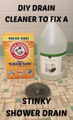 a bottle of liquid next to a sink drainer and box of laundry deterant