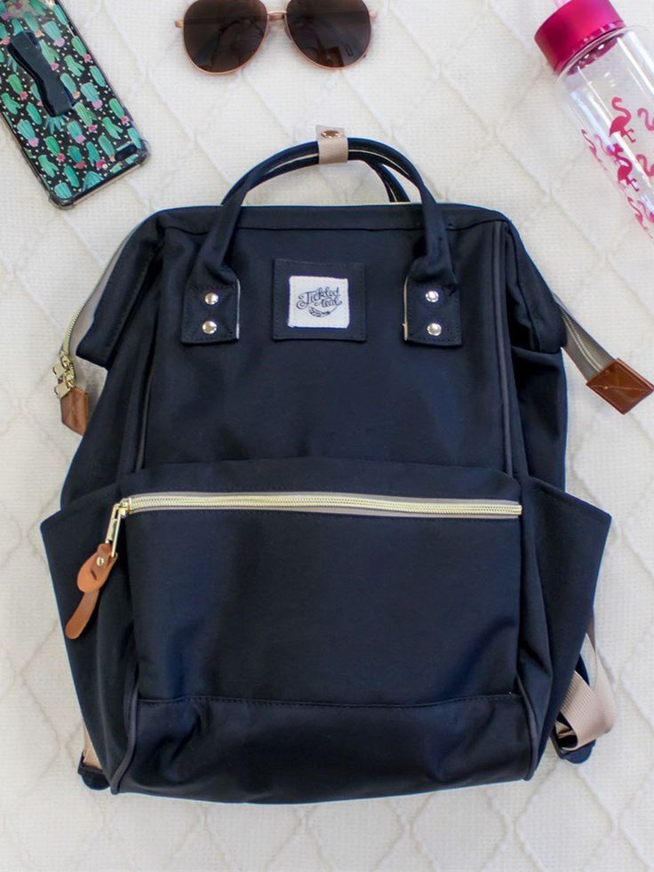 An everyday backpack that will keep you organized and ready for your next adventure. Accessible zippers and pockets to stuff with all your favorite items and one for snacks of course! Everyday Large Capacity Black Backpack, Black Backpack With Zipper Pocket For Outdoor Activities, Black Backpack For Everyday Use And Back To School, Black Backpack With Zipper Closure For Back To School, Everyday Use Black Backpack For Back To School, Black Rectangular Backpack With Cell Phone Pocket, Everyday Black Backpack For Back To School, Black Backpack With Zipper For Back To School, Black Travel Backpack With Pockets