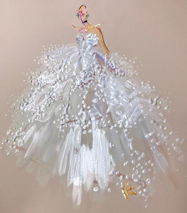 a christmas ornament with a woman in a white dress and pearls on it