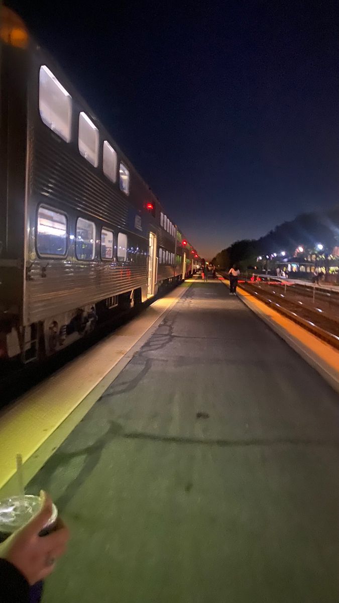 a passenger train that is sitting on the tracks