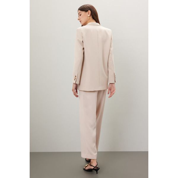 Off-white crepe (60% Acrylic, 40% Polyester). Blazer. Long sleeves. Collar. Front button closure. 28.5" from shoulder to hemline. Imported. Spring Structured Blazer With Button Cuffs, Spring Workwear Suits With Button Cuffs, Feminine Tailored Blazer With Notch Lapel, Tailored Feminine Formal Blazer, Feminine Tailored Formal Blazer, Tailored Feminine Blazer With Lapel Collar, Formal Beige Blazer With Button Cuffs, Beige Formal Blazer With Button Cuffs, Feminine Tailored Office Blazer