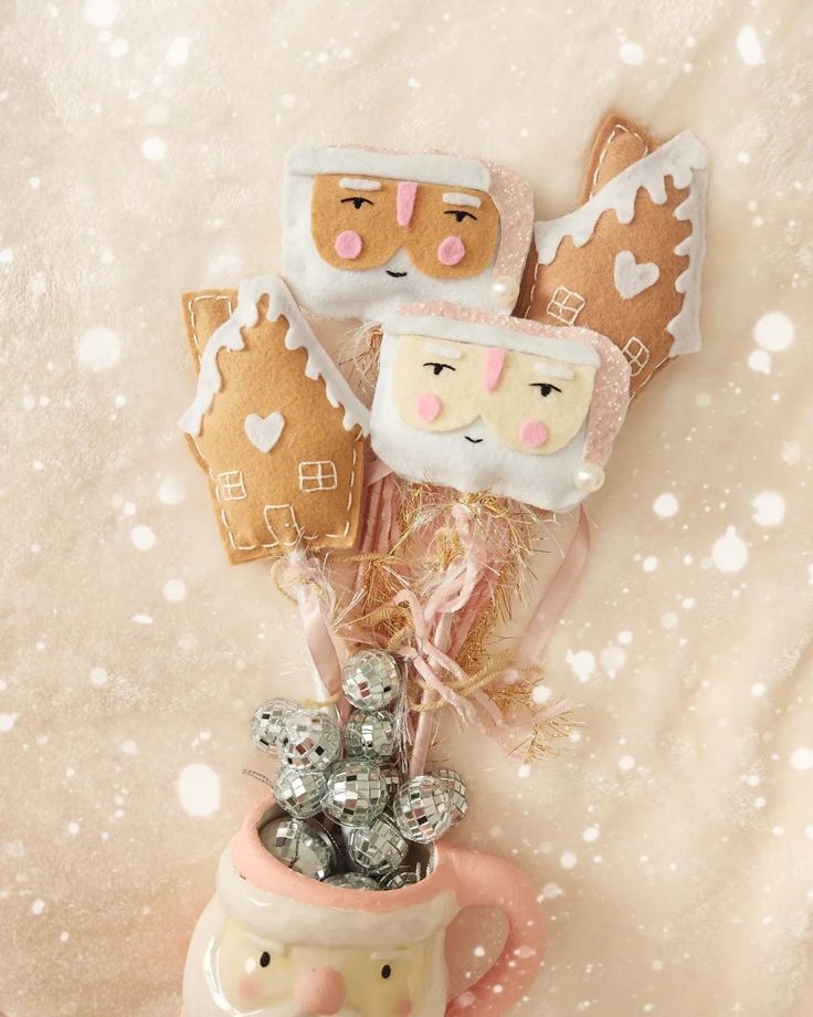 a mug filled with cookies and candy on top of a table