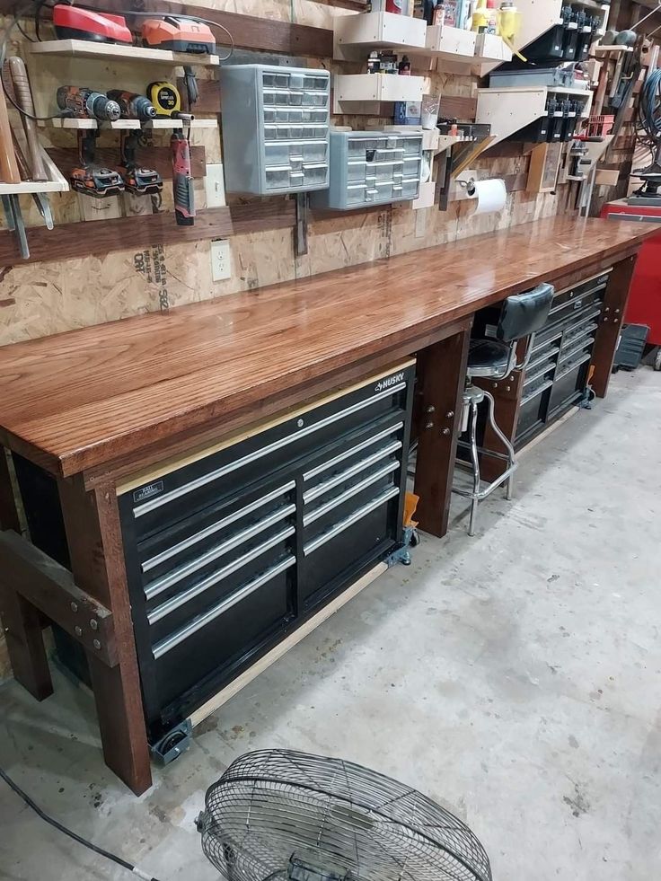 a workbench with lots of tools on it