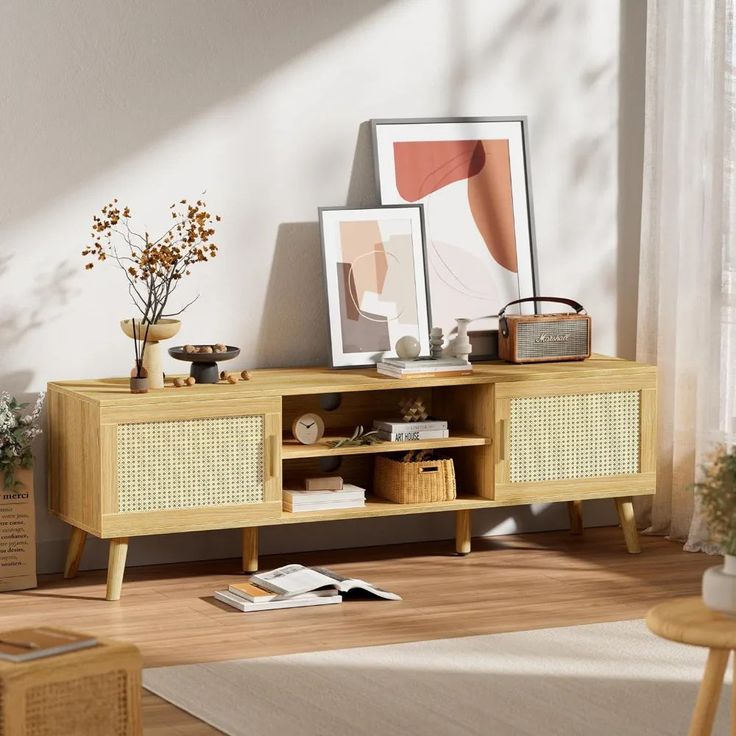 a living room scene with focus on the sideboard and shelf that has pictures on it