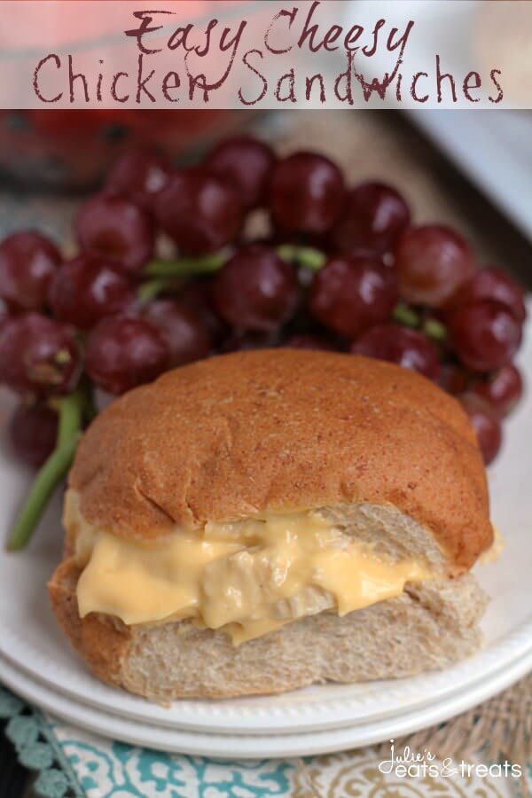 a sandwich with cheese and grapes on a plate