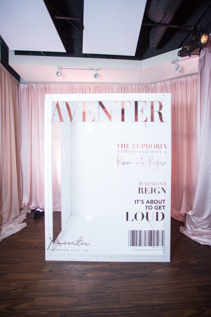 the front cover of an event magazine with pink drapes hanging from it's walls