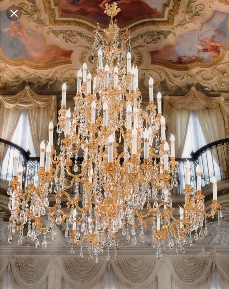 a large chandelier hanging from the ceiling in a room