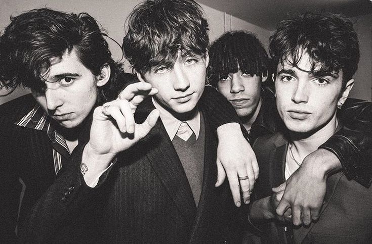 black and white photograph of four young men