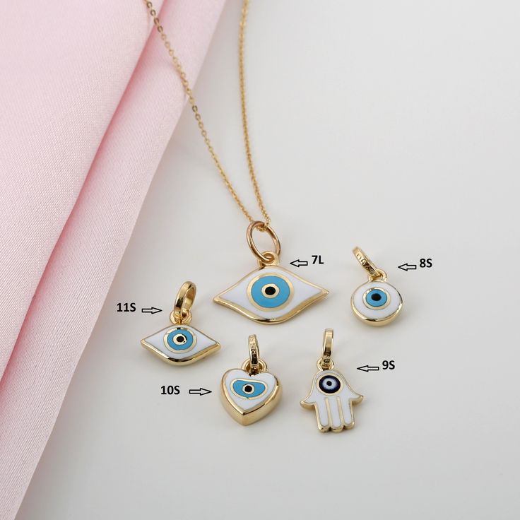 Handmade Solid 14k Gold Enamel Charms are Absolutely stunning. You can buy them either as a charm or you can purchase chain for it by simply clicking on the listing URLs at below. Chains are sold seperately ⛓ Cable Chain https://etsy.me/2IoJFoV ⛓ Paper Clip Chain https://etsy.me/39OJ631 ⛓ Ball Chain https://etsy.me/36SGoaF ✔ Charm Diameters are approximetly 1/2 inch ( 1.25cm - 1.5cm ) Bails are 6mm. Larger ones are 8mm ( has L after number ) Available 14K Solid Yellow Gold Worldwide DHL shipping Evil Eye Enamel Jewelry As A Gift, Evil Eye Enamel Jewelry Gift, Yellow Gold Enamel Charms For Gift, White Charm Necklaces For Good Luck, White Evil Eye Jewelry Gift, White Good Luck Charm Necklace, White Good Luck Charms Necklace, Symbolic Enamel Jewelry As A Gift, Symbolic Enamel Jewelry For Gifts