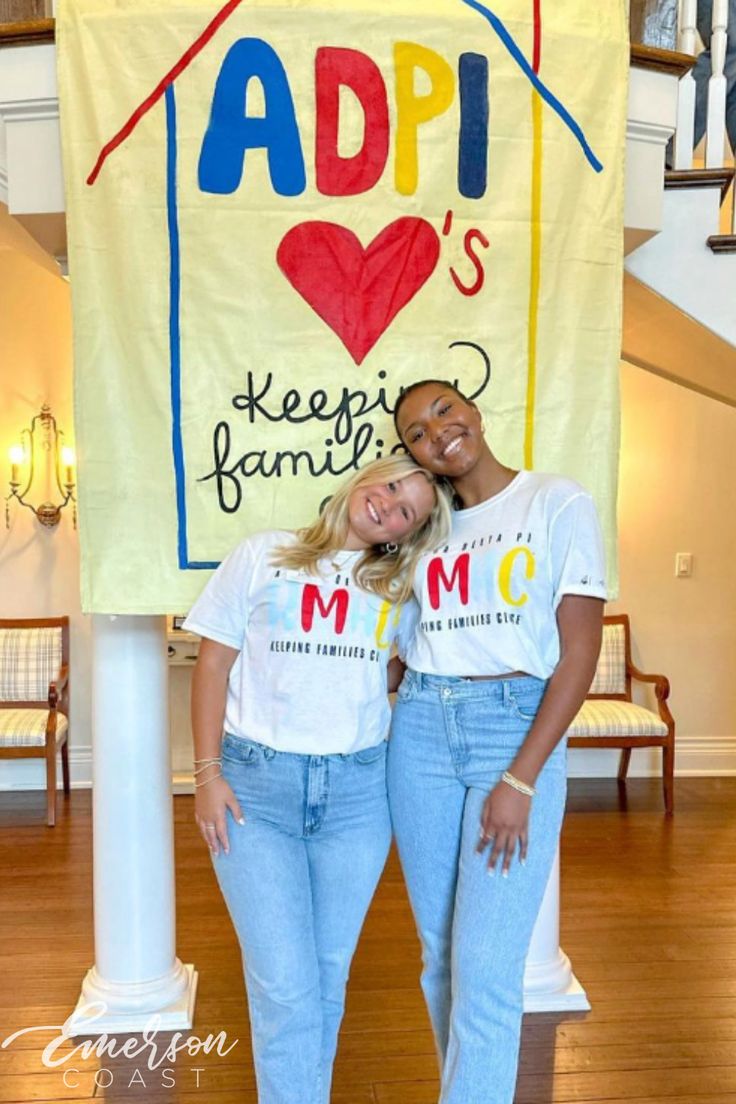 two women standing in front of a sign that says appi's keep family