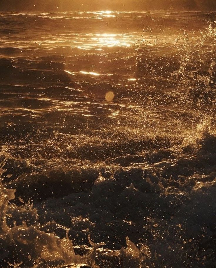 the sun shines brightly through the water as it reflects on the waves in the ocean