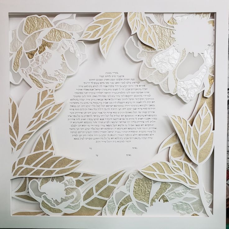 the paper cut flowers are arranged on top of each other in a white box frame