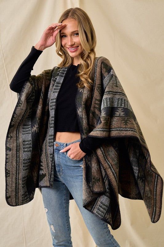 Bring an element of warmth and coziness to your wardrobe with this Shawl Wrap Poncho! Perfectly patterned with a classic olive multi Aztec design, this wrap is both festive and fashionable – the ideal way to make your winter style stand out from the crowd! Look hot while staying toasty! 🔥 Color: Olive Multi Size One Size 100% Acrylic, imported OBS4144 Green One Size Winter Outerwear, One Size Green Winter Outerwear, One Size Green Outerwear For Winter, Cozy Shawl For Cold Weather In Fall, Casual Shawl Wraps For Winter, Casual Winter Shawl Wrap, One-size Bohemian Outerwear For Cold Weather, One Size Bohemian Outerwear For Cold Weather, Bohemian One-size Outerwear For Cold Weather