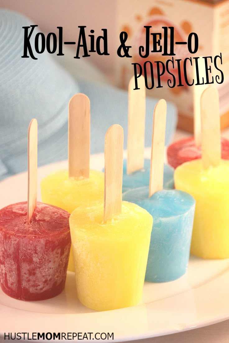 small popsicles are lined up on a white plate