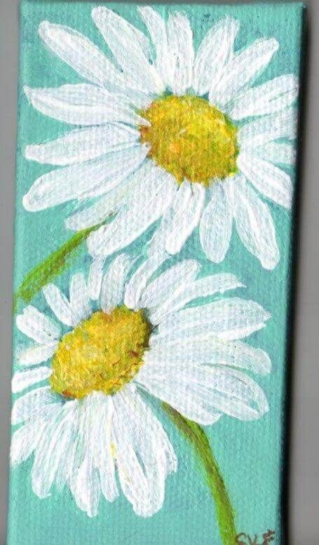 two white daisies painted on a blue background