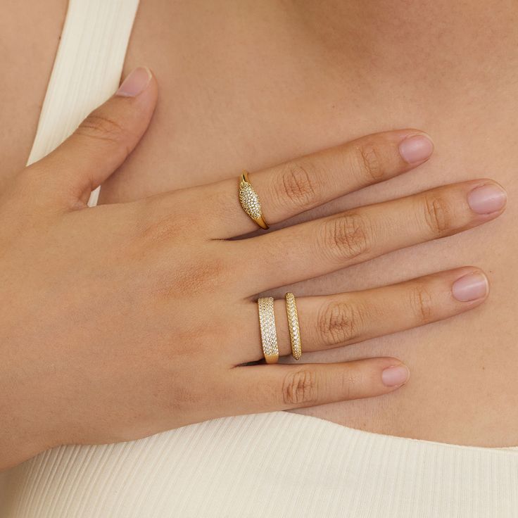 Make a sparkly statement with our signet pinky ring. A classic yet bold ring made with an extremely light-weight design. Best worn with our other daintier rings to create a layering effect. -Made in 18k gold plating- Band thickness: 7.5mm- Hypoallergenic & nickel free If you are in between sizes, we recommend sizing up. Ring Size Chart Dainty Gold Plated Everyday Signet Ring, Everyday Fine Jewelry Gold-plated Signet Ring, Everyday Fine Jewelry Gold Plated Signet Ring, Everyday Gold Plated Open Signet Ring, Everyday Open Diamond Ring With Cubic Zirconia, Everyday Open Cubic Zirconia Ring, Trendy Gold-plated Anniversary Rings, Cubic Zirconia Open Signet Promise Ring, Trendy Gold Plated Rings For Anniversary