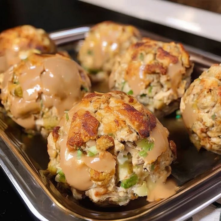 some food is sitting on a metal tray