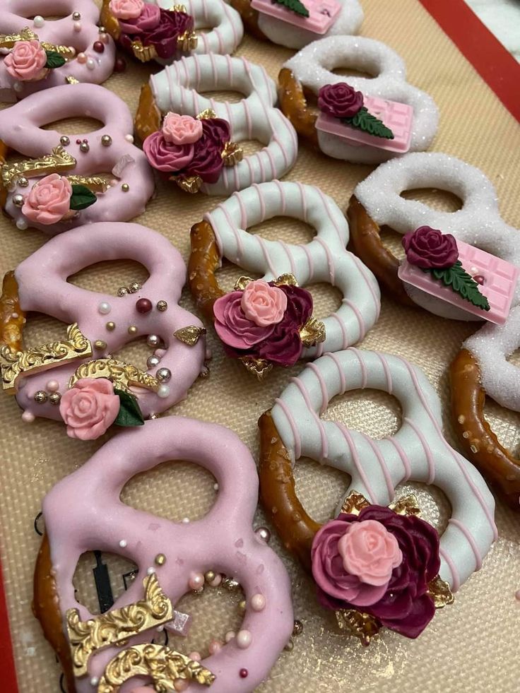 there are many decorated doughnuts on the table