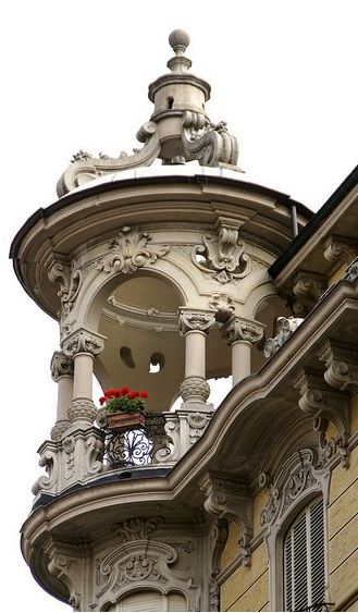 an ornate building with balcony and balconies