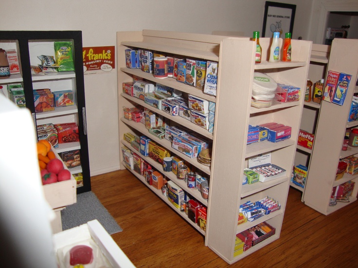 the shelves are filled with various types of food and snacks for children to buy at the store