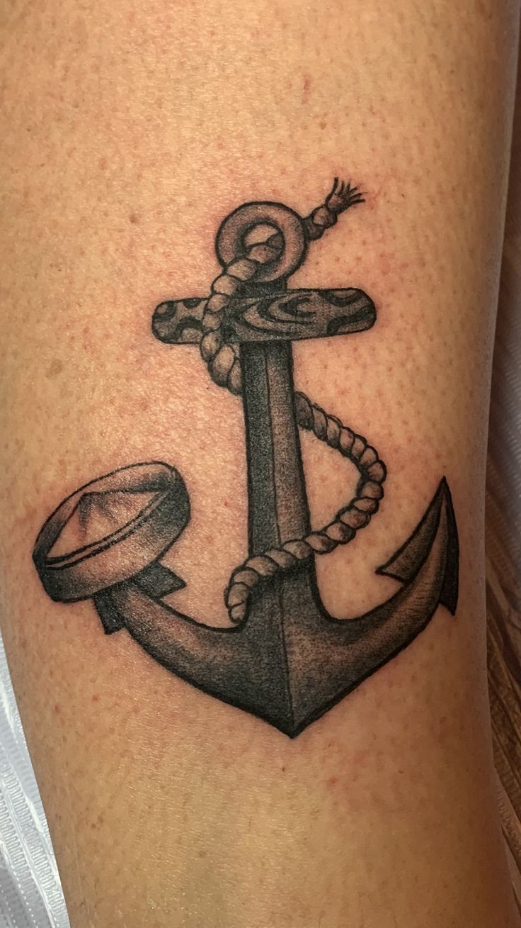 an anchor tattoo on the leg