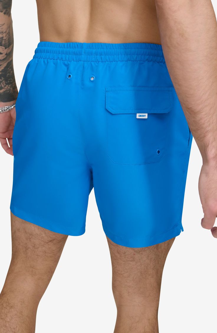 Soak up the sun in these recycled-fiber swim trunks built with UPF 40+ sun protection. 5" inseam (size Medium) Elastic/drawstring waist Front slant pockets; back patch pocket Lined 100% REPREVE polyester REPREVE recycled polyester is made from 100% post-consumer recycled plastic bottles Machine wash, tumble dry Imported Stretch Nylon Swim Trunks With Upf 50+, Solid Color Moisture-wicking Nylon Swim Trunks, Blue Moisture-wicking 4-way Stretch Swim Trunks, Blue Nylon Swim Trunks With Upf 50+, Blue 4-way Stretch Swim Trunks For Swimming, Mario Valentino, Soak Up The Sun, Designer Crossbody Bags, Blue Fits