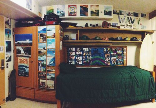 a bedroom with a bed, bookshelf and pictures on the wall