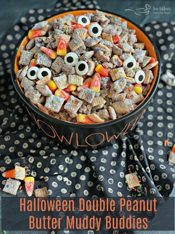 a bowl filled with halloween treats on top of a table