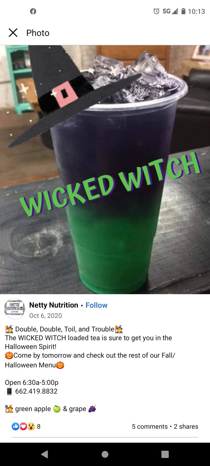 a cup that has some kind of witches hat on it's top and the words,