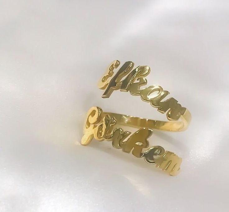 This 14K solid gold double name ring  is a  meaningful gift for your loved one or a special treat just for yourself . You can buy this personalized two name ring as an engagement ring which includes couple's names . This affordable and thoughtful custom multiple name ring gift will surely be treasured by your loved one.   *FEATURES Material : 14 K Solid Gold  Colour : gold * PACKAGING Jewels will be sent nicely wrapped and packed in a box! If specific goods are intended as gifts, please leave us a note. We'll use a special box separately and include a gift card for you! The most unique jewelry you can find, a perfect gift for you and your loved one ... Birthday Gift , Wedding Gift , Gift For Love ,  Bridesmaid Gift , Anniversary Gift , Mother's Day Gift , Graduation Gift * SHIPPING DETAILS Gold Promise Ring With Name, Gold Name Rings As Gift, Gold Promise Ring With Name Detail, Gold Nameplate Engraved Ring For Anniversary, Gold Engraved Nameplate Ring For Anniversary, Custom Name Gold Promise Ring, Gold Promise Ring With Custom Name, Yellow Gold Custom Name Promise Rings, Yellow Gold Promise Rings With Custom Name