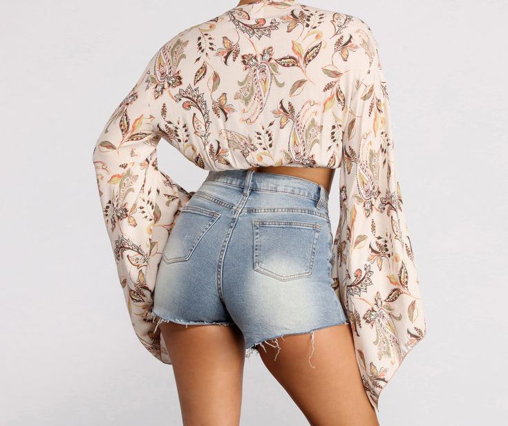 This paisley print crop top is giving us major boho vibes. Style it with high waist denim shorts and heels for the perf summer look!Fits & Features Plunging V Neckline Adjustable Wrap Tie Detail Batwing Sleeves All Over Paisley Print Model is 5'7" with a 34" bust. 24" waist and 36" hips. She is wearing a size small. Chic Short Crop Top For Vacation, Trendy Short Crop Top For Beach, Chic Crop Top For Vacation, Trendy Crop Top For Beach, Trendy Short Crop Top For Vacation, Spring Vacation High Waist Crop Top, Spring Beach Crop Top, Short Crop Top For Spring Vacation, High Waist Crop Top For Spring Vacation