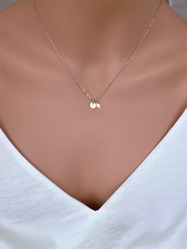 "Tiny Gold Cross Necklace God Bless Necklace is made with 14k Gold fill or Sterling silver Shiny surface. Use for everyday and comfort wearing... Petite and light weight . It consists of .. -4.3 x 7.3mm 14k gold fill or Sterling silver Tiny Cross pendent, -7mm Gold fill or Sterling silver initial charm, -14k gold fill chain or Sterling silver chain 14\", 16\" or 18\" end to end spring claw. it come with small ribbon gift box and care package . It could be sterling silver as well. MORE CROSS http Simple 14k Gold Initial Pendant Charm Necklaces, Simple 14k Gold Initial Pendant Charm Necklace, Simple Tiny Initial Pendant Charm Necklaces, Simple Tiny Initial Pendant Charm Necklace, Simple Tiny Initial Pendant Necklace, Simple Charm Necklace For Anniversary, Simple Tiny Initial Pendant Jewelry, Cross Pendent, Tiny Cross Necklace