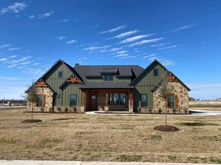 a large house in the middle of a field