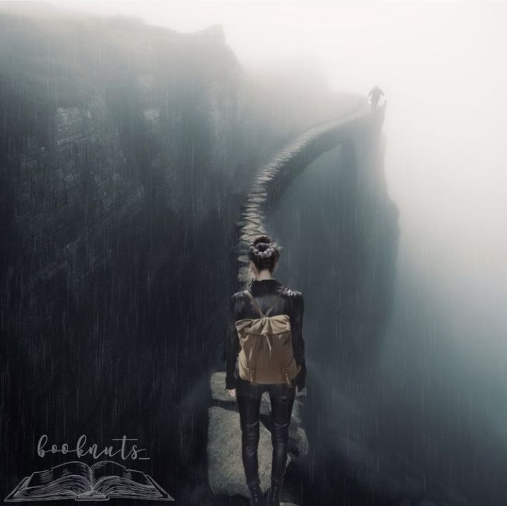 a person standing on a bridge in the rain with an open book and backpack over their shoulder