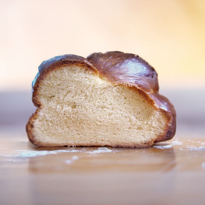 a piece of bread that has been cut in half and is sitting on the table