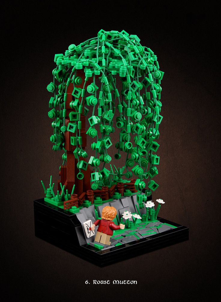 an image of a tree made out of legos with green lights on it's branches