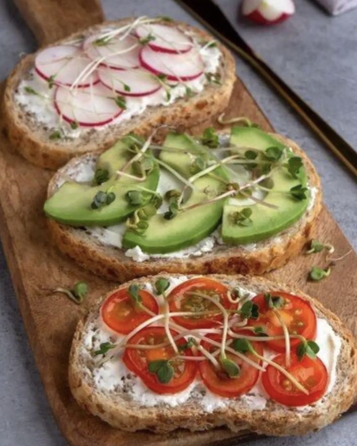 three slices of bread with veggies on them