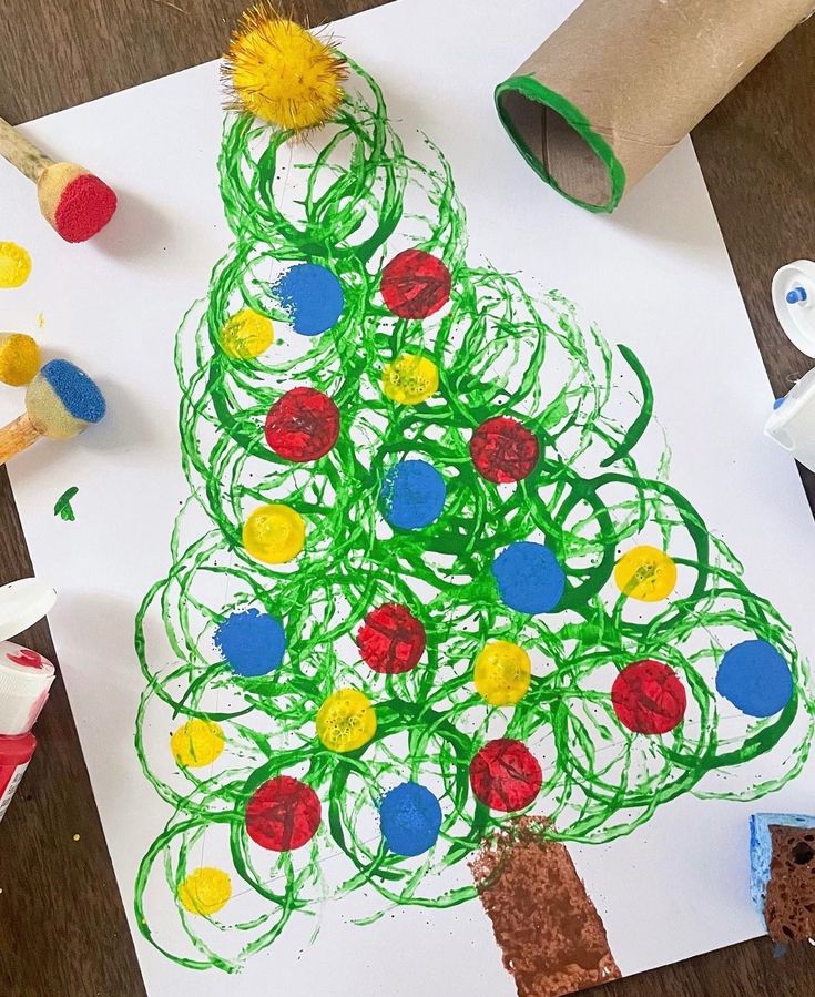 a child's drawing of a christmas tree on paper