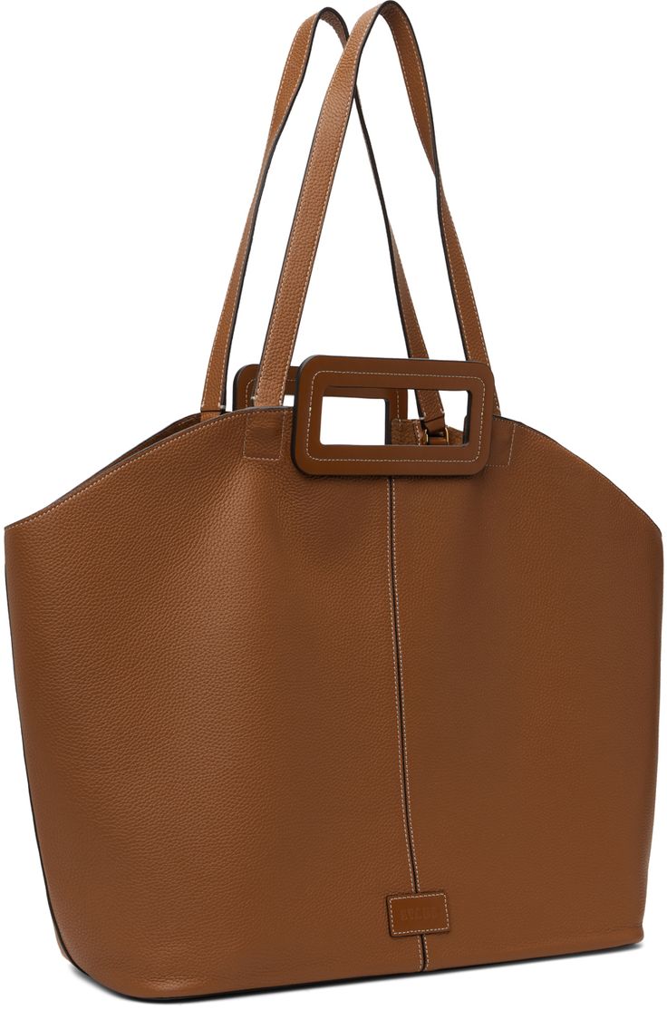 Grained leather tote in tan. · Twin carry handles and shoulder straps · Logo patch at face · Lobster clasp at interior · Detachable zip pouch at interior · Suede lining · Contrast stitching in white · H13 x W22.5 x D6 Supplier color: Tan Brown Calf Leather Shoulder Bag With Handles, Modern Staud Satchel Bag, Modern Staud Rectangular Bag, Modern Rectangular Staud Bags, Modern Rectangular Staud Bag, Staud Satchel Bag With Detachable Handle, Staud Satchel With Detachable Handle, Staud Bags With Top Carry Handle For Everyday, Staud Shoulder Bag With Detachable Handle For Shopping