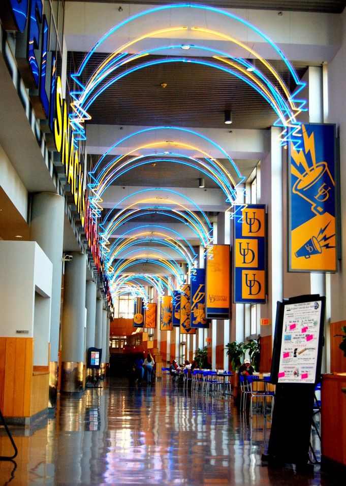 the inside of a building with lights and signs