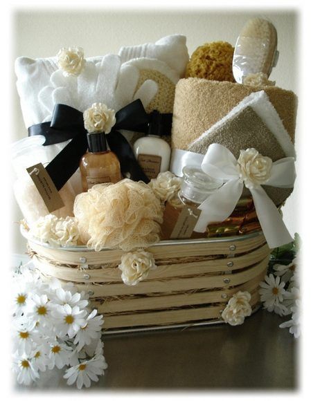 a basket filled with lots of different types of towels and soaps on top of a table