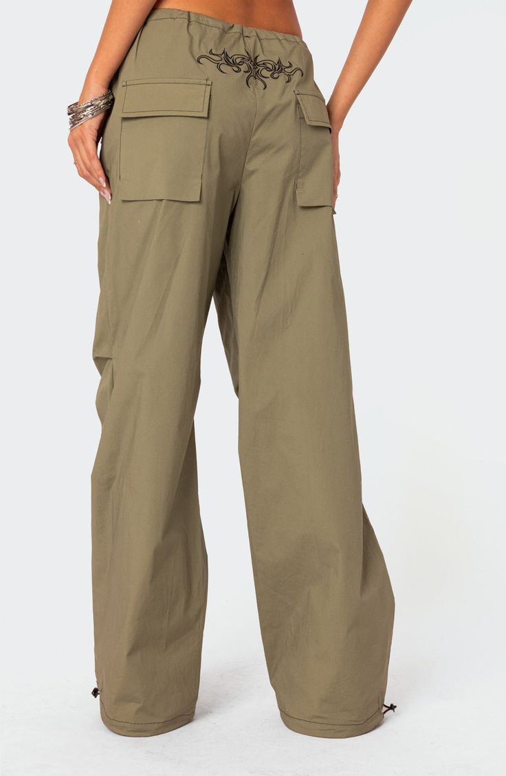 A baggy, Y2K-inspired fit gives you room to move in these lightweight, stretch-kissed cotton pants featuring utilitarian drawcords and cargo pockets. Drawcord-toggle waist Front slant flap pockets; back flap patch pockets; cargo flap-patch pockets Drawcord-toggle cuffs 95% cotton, 5% spandex Machine wash, dry flat Imported Cargo Parachute Pants, Visionary Fashion, Denim Cargo Pants, Outfits Y2k, Swimwear Dress, Move In, Cotton Pants, S Models, Model Height