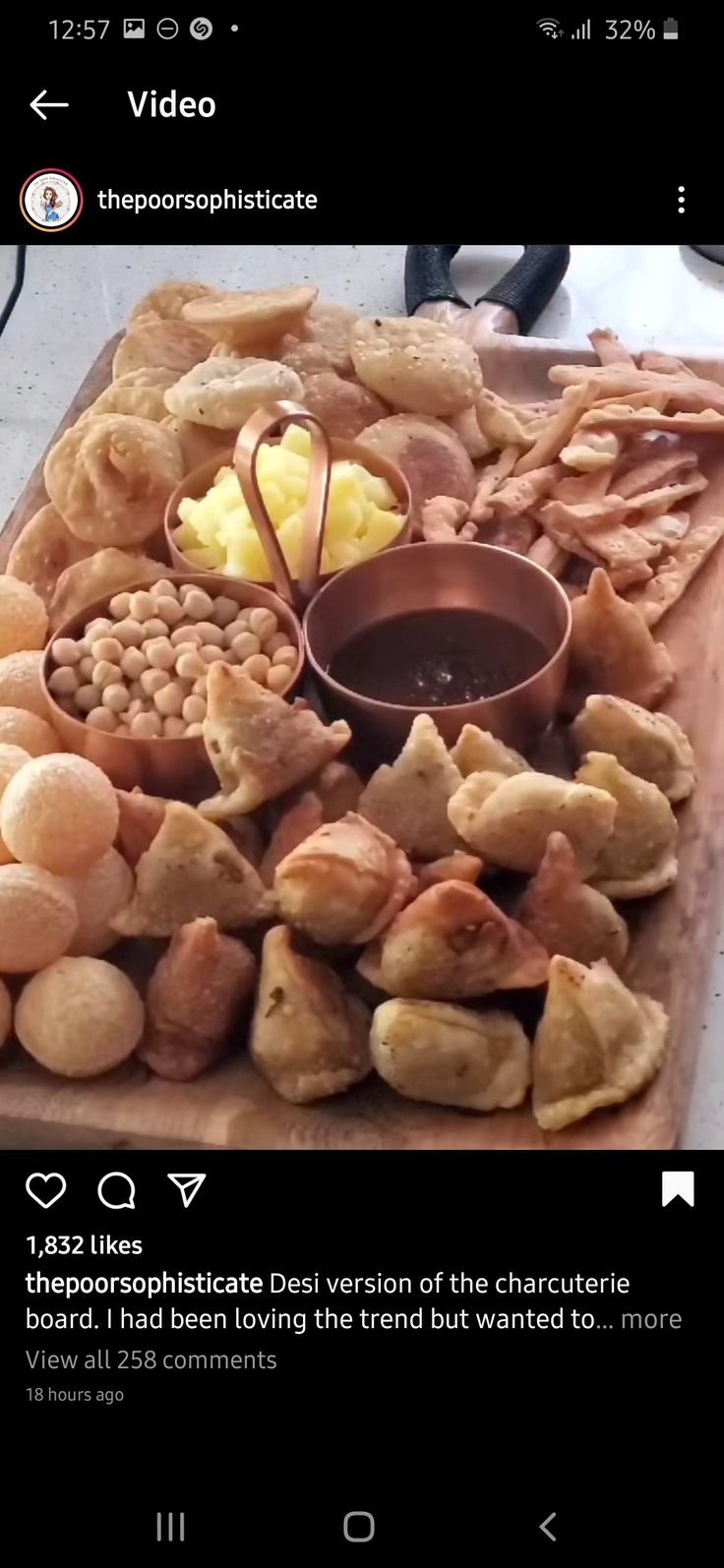 a table topped with lots of food on top of a wooden cutting board