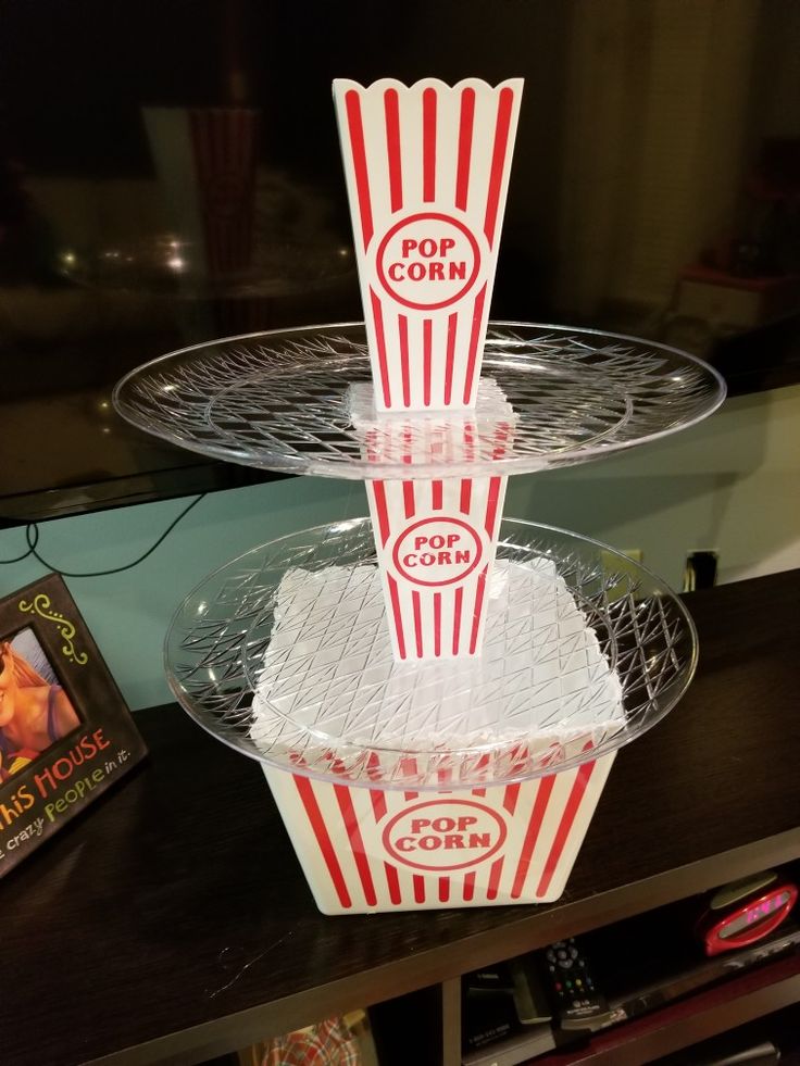 two trays with popcorn on top of each other